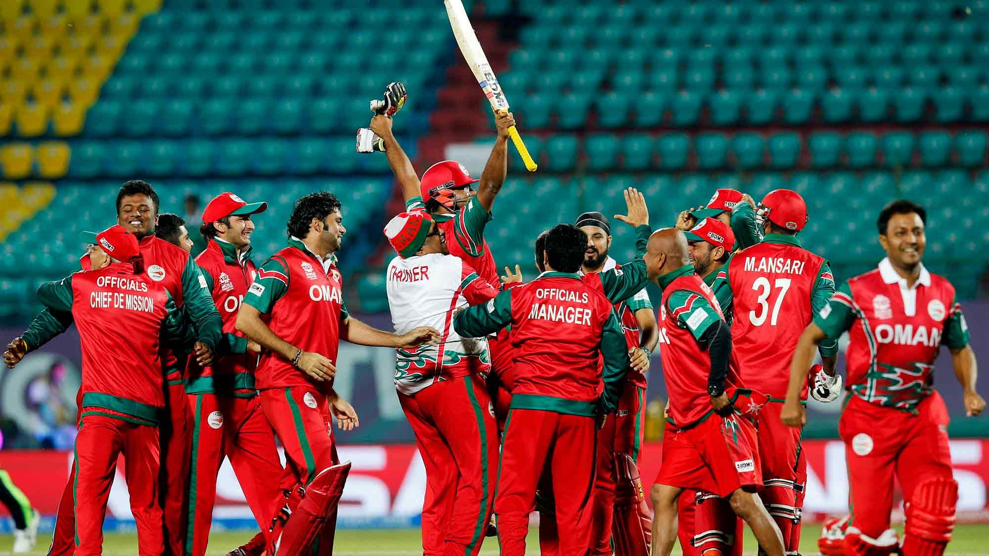 Oman players celebrate after the shock victory over Ireland. (Photo: AP)