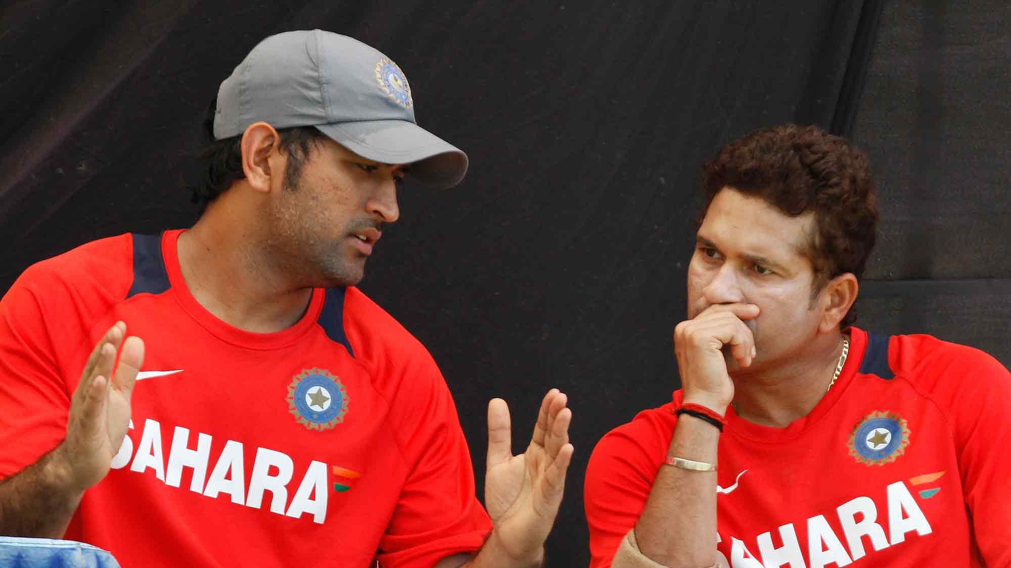File picture of MS Dhoni and Sachin Tendulkar during a training session.