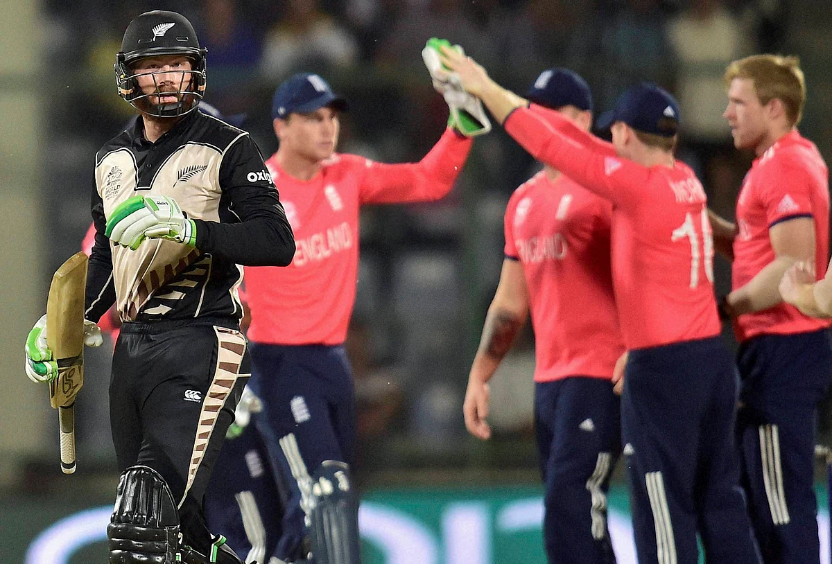 New Zealand batsman M Guptill leaves the ground after losing his wicket to David Willey. (Photo: PTI)