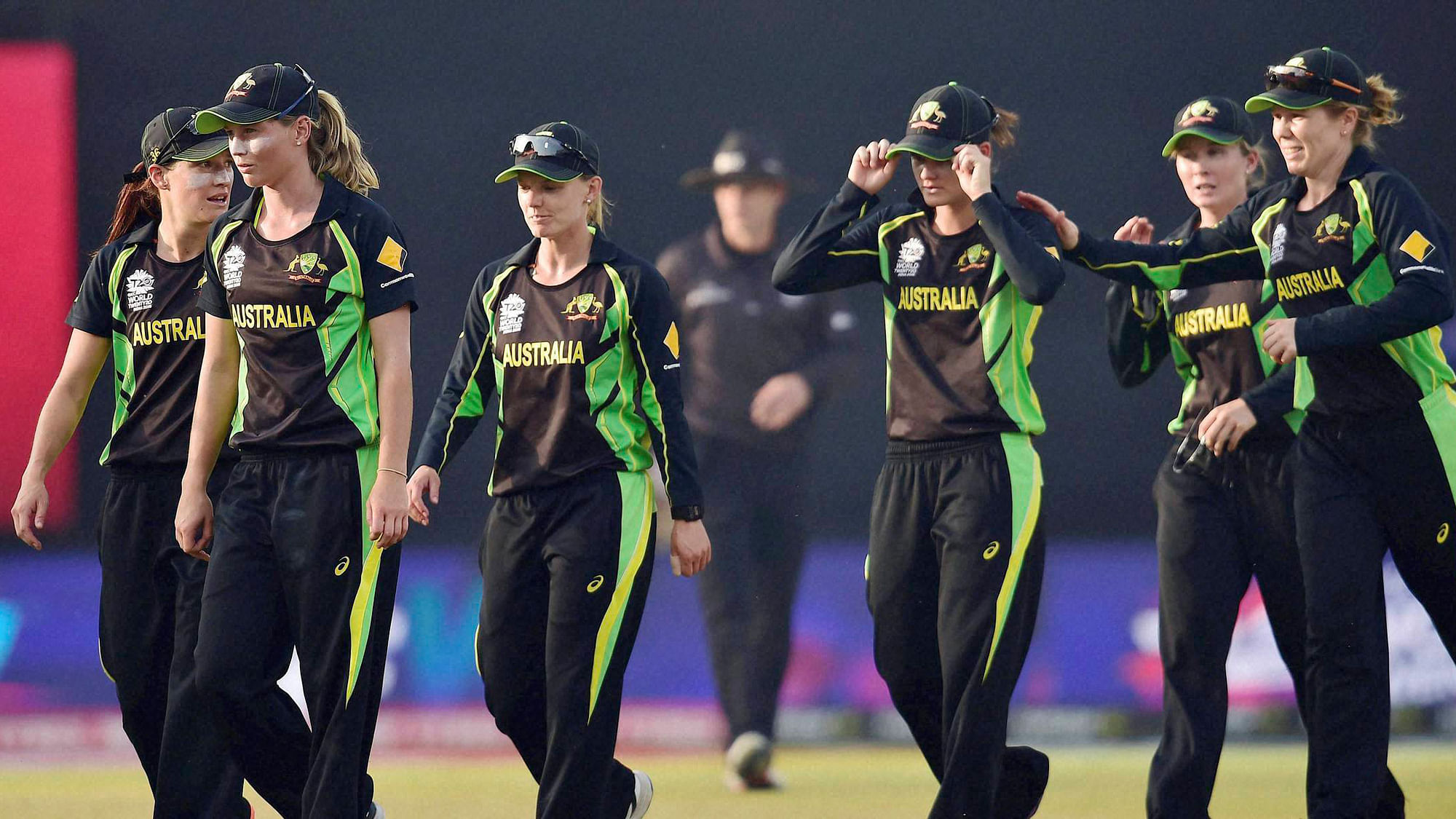 Australian cricketers walk back to the pavilion after beating England by five runs in the first semifinal of ICC Women’s World T20 at Feroz Shah Kotla stadium in New Delhi (Photo: PTI)