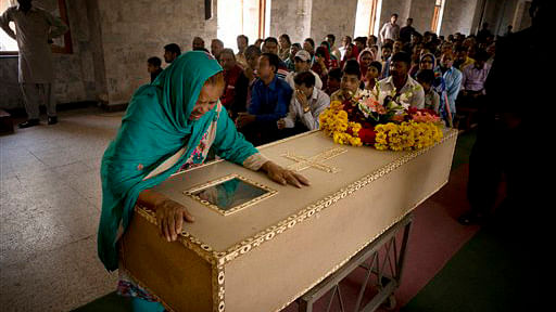 

The grandmother of Pakistani Christian boy mourns his death, at a church in Lahore. (Photo: AP/BK Bangash)