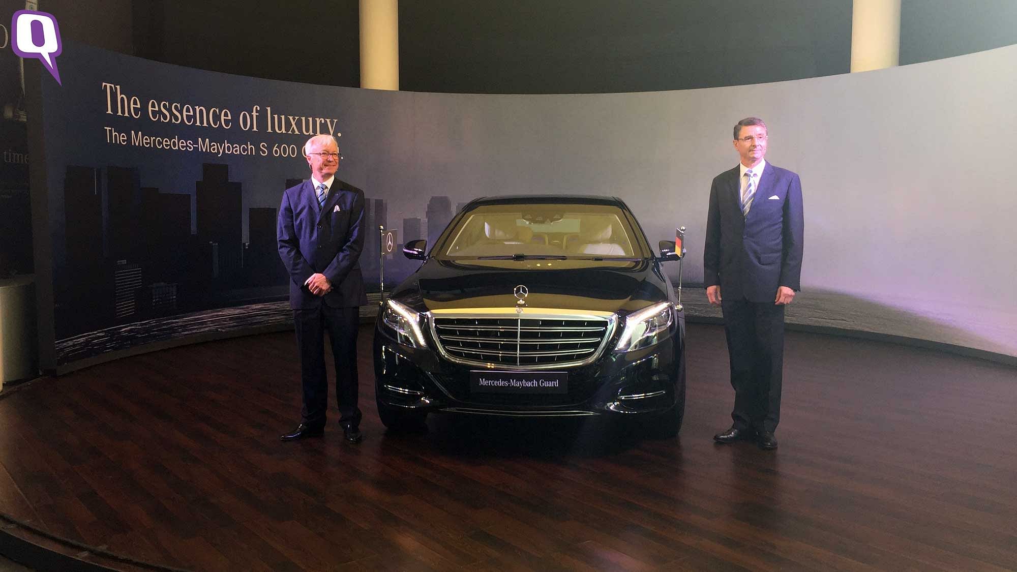 German Ambassador to India, Dr Martin Ney (Right) and Roland Folger, Managing Director and CEO, Mercedes-Benz India (Left) with the new Mercedes-Maybach S600 Guard. (Photo: <b>The Quint</b>)