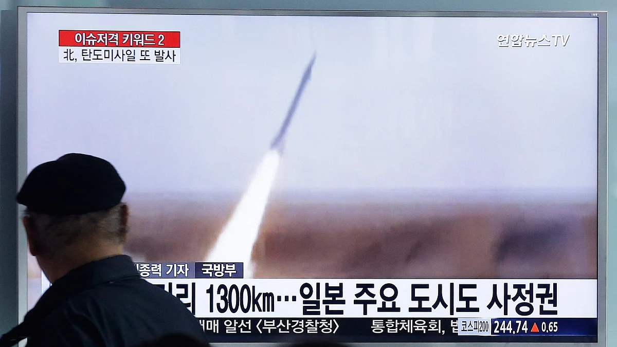 A man watches a TV screen showing file footage of the missile launch conducted by North Korea, at Seoul Railway Station in Seoul, South Korea, March 18, 2016. (Photo: AP)