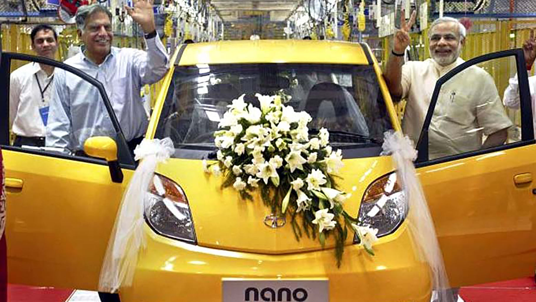 Tata Group Chairman Ratan Tata, (left) and the then Gujarat
Chief Minister Narendra Modi rolling out the first Tata Nano in Sanand, near
Ahmedabad. (Photo: AP)