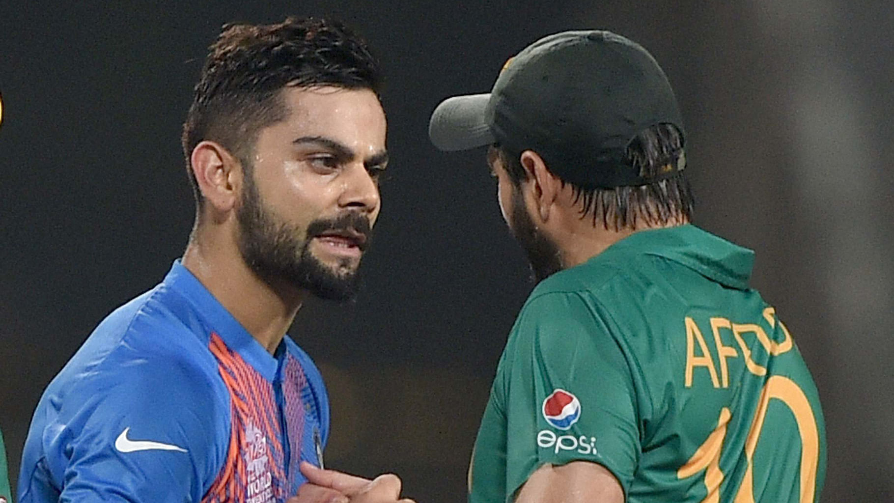 Virat Kohli being greeted by Pak captain Shahid Afridi after winning the match against Pakistan during the ICC T20 World cup at Eden Garden in Kolkata on Saturday. (Photo: PTI)