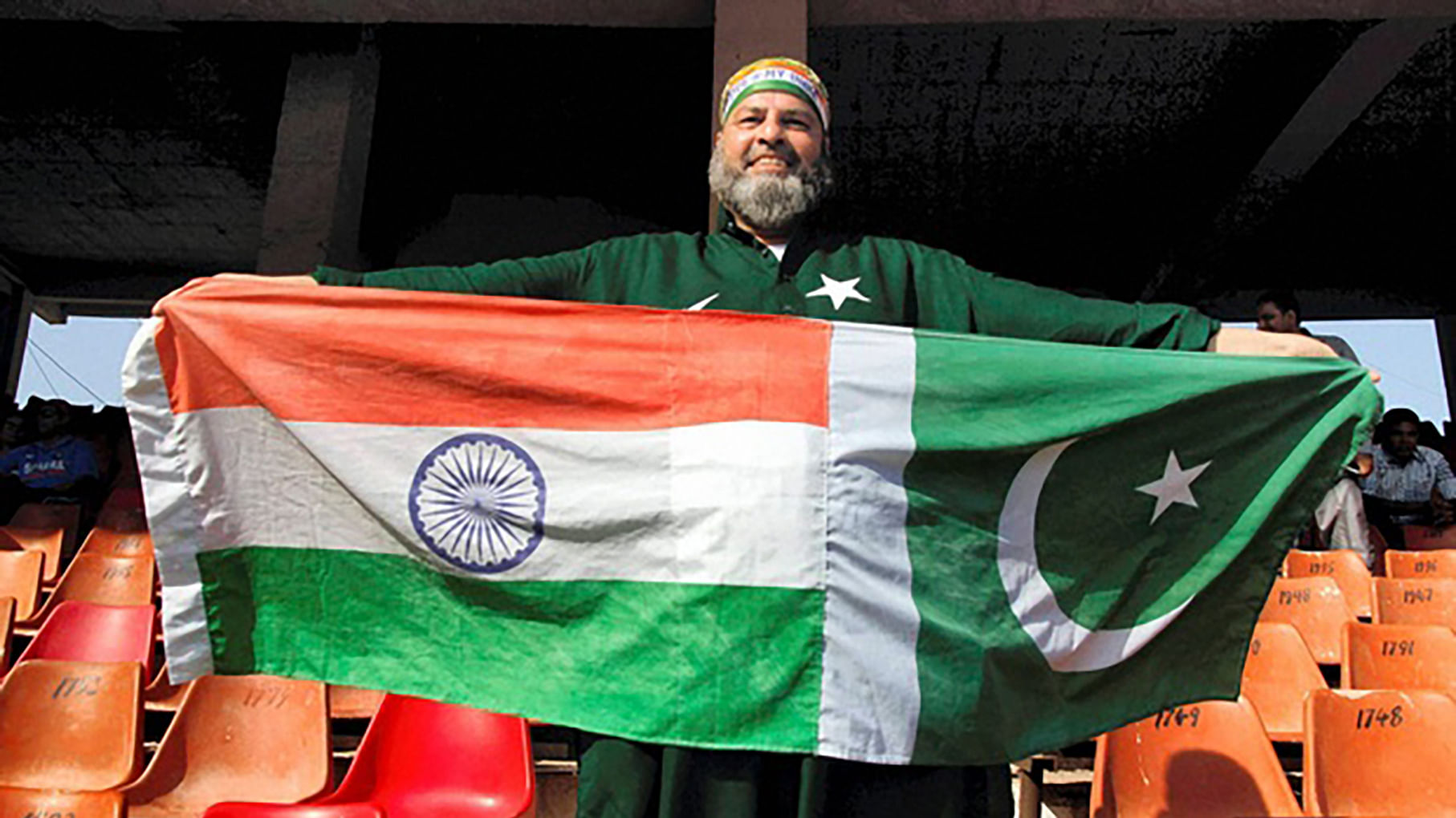 Mohammad Bashir a cricket fan displays flags of both India
and Pakistan during a T20 cricket match between India and Pakistan in Ahmedabad. (Photo: PTI)