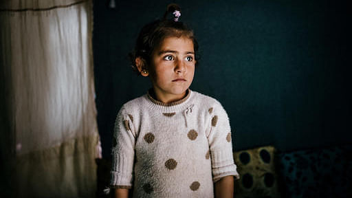 In this March 6, 2016 photo, Winda Farman Haji poses for a portrait inside the tent she shares with her family at Kawergosk refugee camp in Iraq.  (Photo: AP)