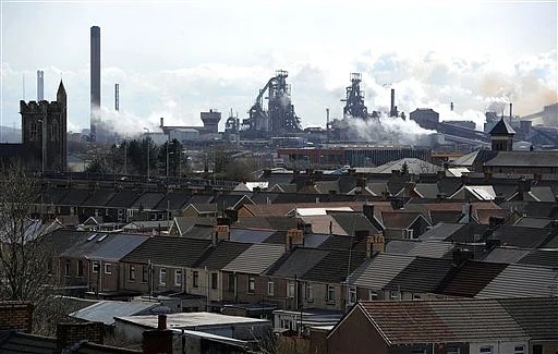 The Tata steel plant dominates the skyline over the roof tops of Port Talbot, Wales (Photo: AP)