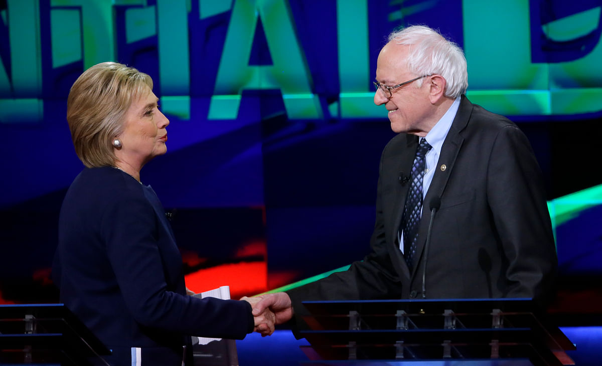 Hillary Clinton and Bernie Sanders angrily clashed over auto industry bailouts, guns and ties to Wall Street.