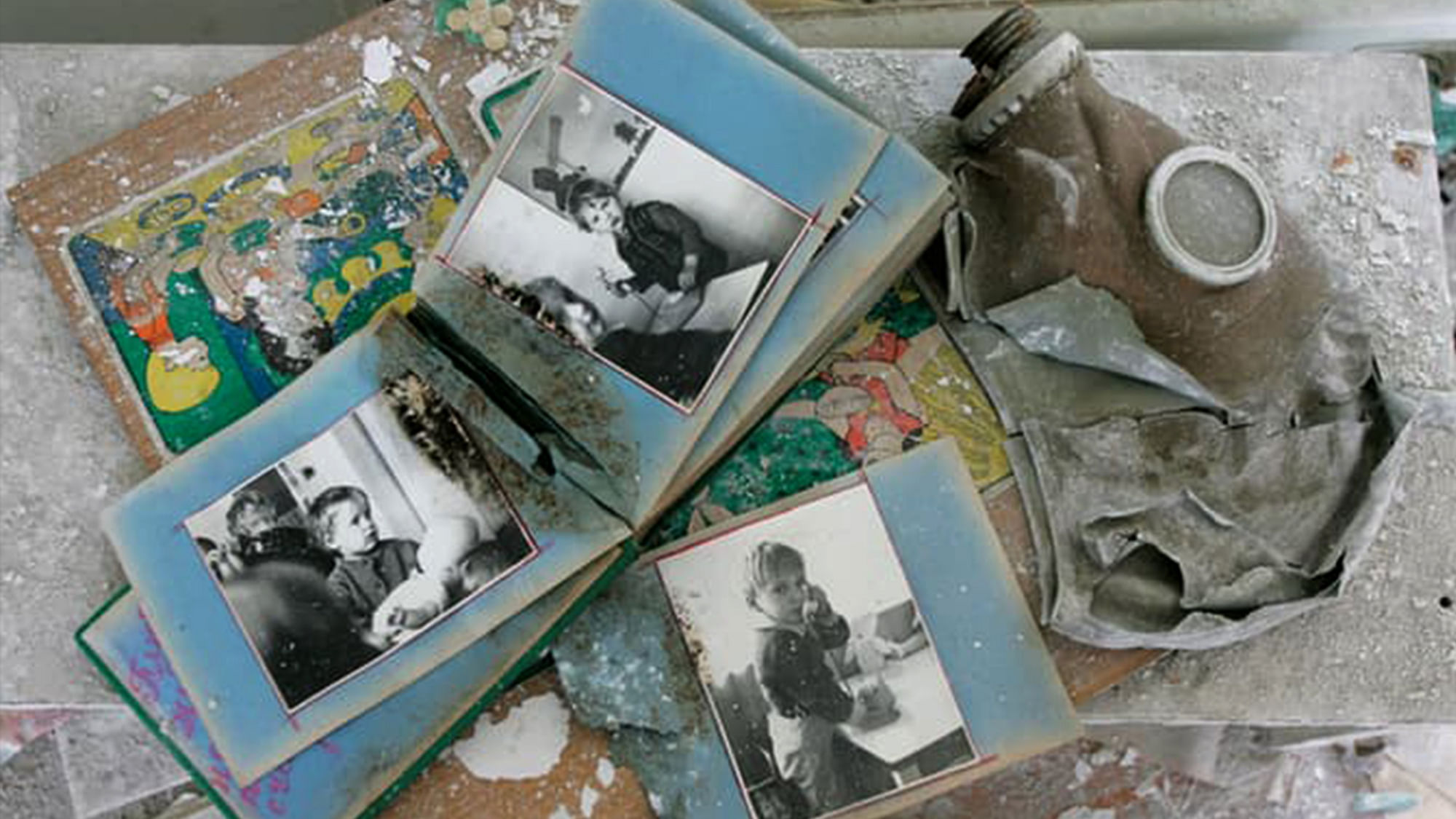 Abandoned photo albums next to a gas mask in the nuclear township of Chernobyl, 3 kms from the nuclear plant. (Photo: Reuters) &nbsp; &nbsp; &nbsp; &nbsp; &nbsp; &nbsp; &nbsp; &nbsp; &nbsp; &nbsp; &nbsp; &nbsp; &nbsp; &nbsp; &nbsp; &nbsp; &nbsp; &nbsp; &nbsp; &nbsp; &nbsp; &nbsp; &nbsp; &nbsp; &nbsp; &nbsp; &nbsp; &nbsp; &nbsp; &nbsp; &nbsp; &nbsp; &nbsp; &nbsp; &nbsp; &nbsp; &nbsp; &nbsp;&nbsp;