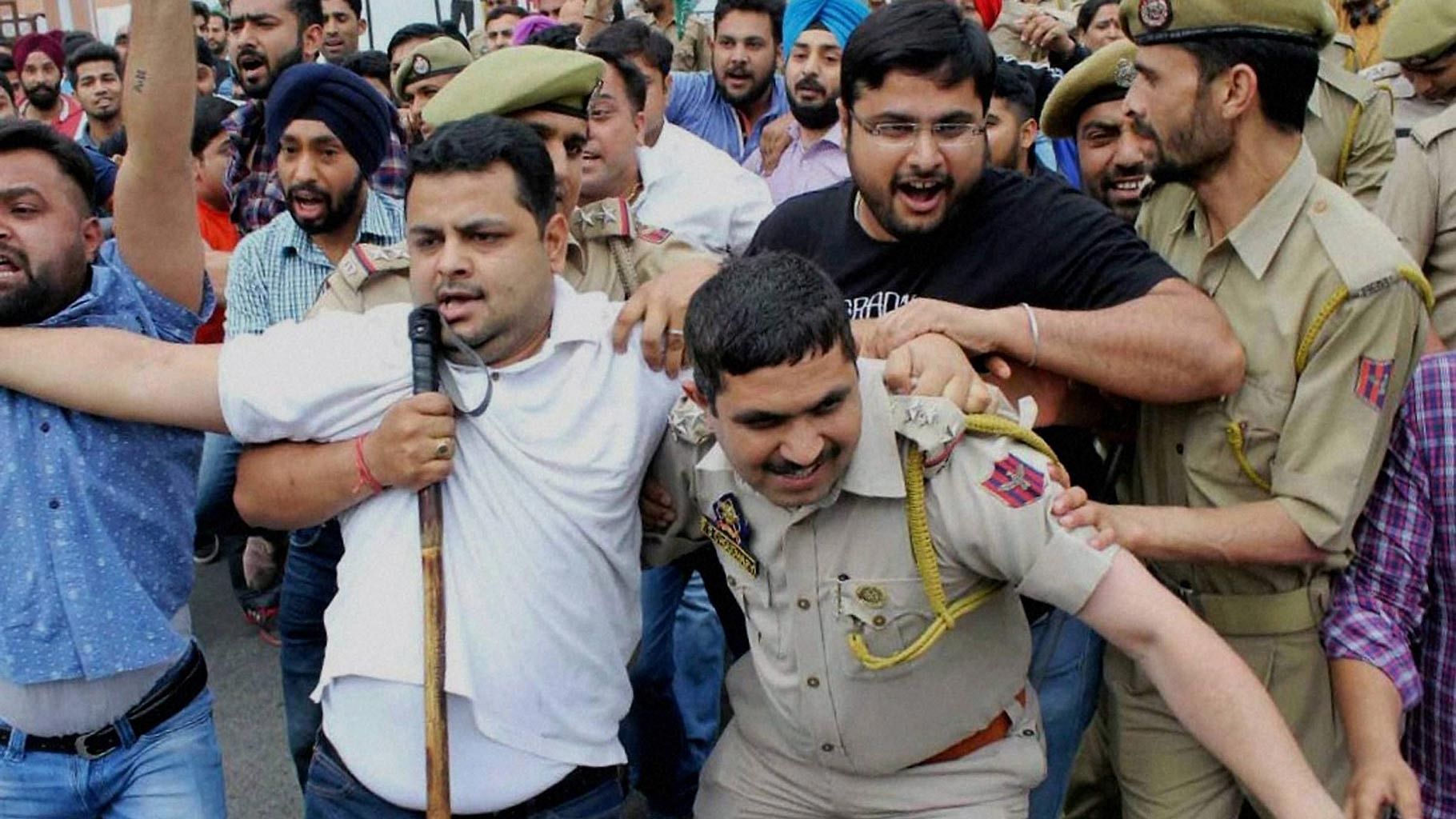 Youth Congress workers protest in front of Jammu and Kashmir Deputy Chief Minister Nirmal Singh’s residence over the NIT Srinagar issue. (Photo: PTI) 