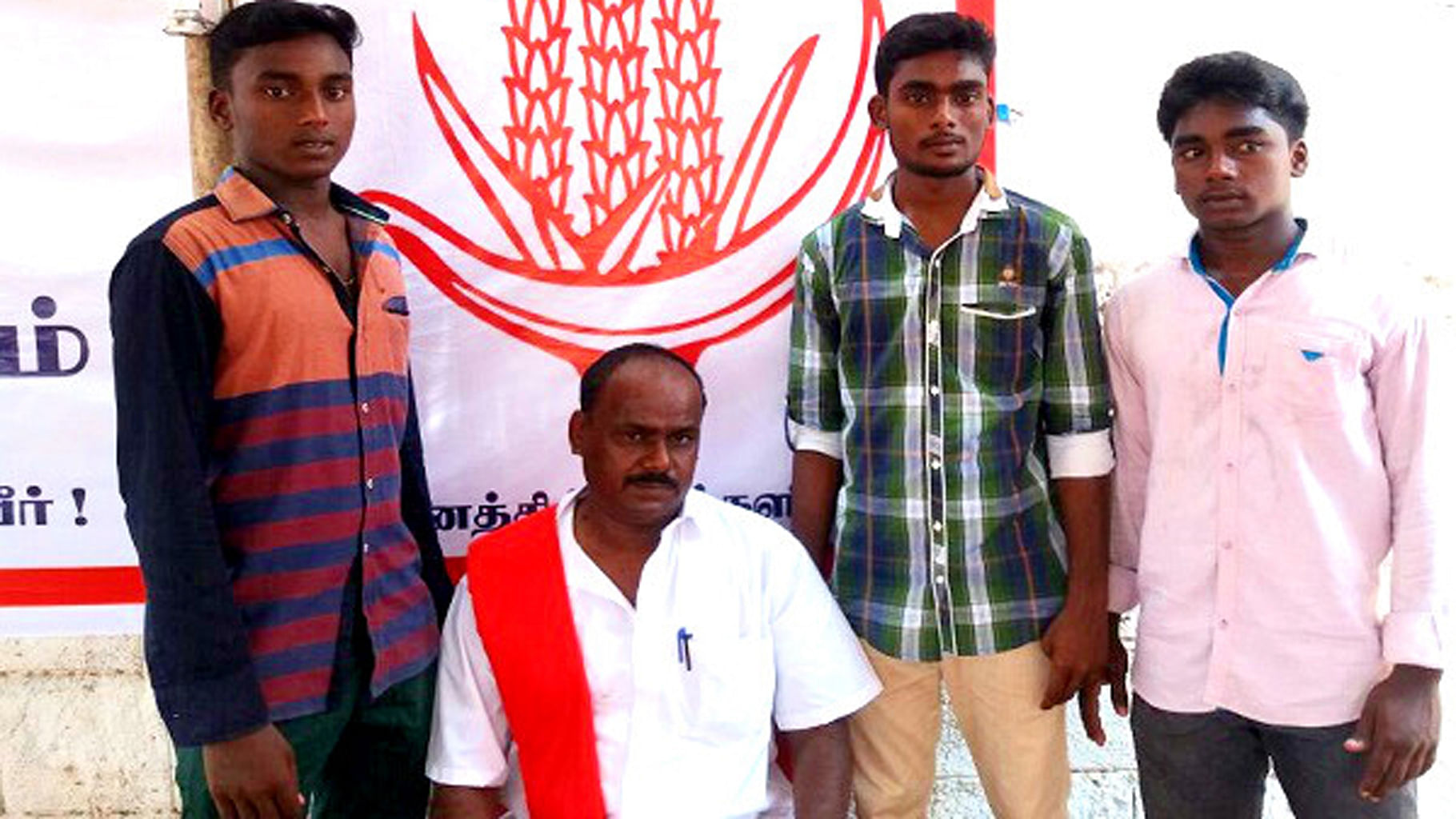 CPI member Mohan with his three sons, Marxism, Leninism and Socialism. (Photo Courtesy: <i>The News Minute</i>)