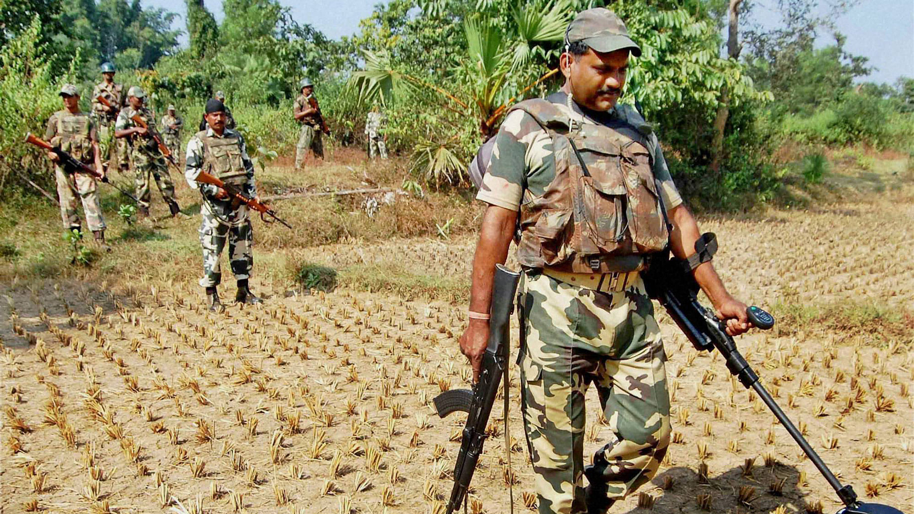 Central paramilitary force jawans  conduct a security check on the eve of the first phase of assembly elections in  Junglemahal,  Bankura district, of West Bengal on Sunday. (Photo: PTI)