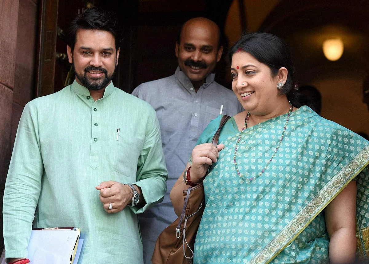 HRD Minister Smriti Irani and BJP MP Anurag Thakur during the Parliament Session in New Delhi on Wednesday, 27 April 2016. (Photo: PTI)