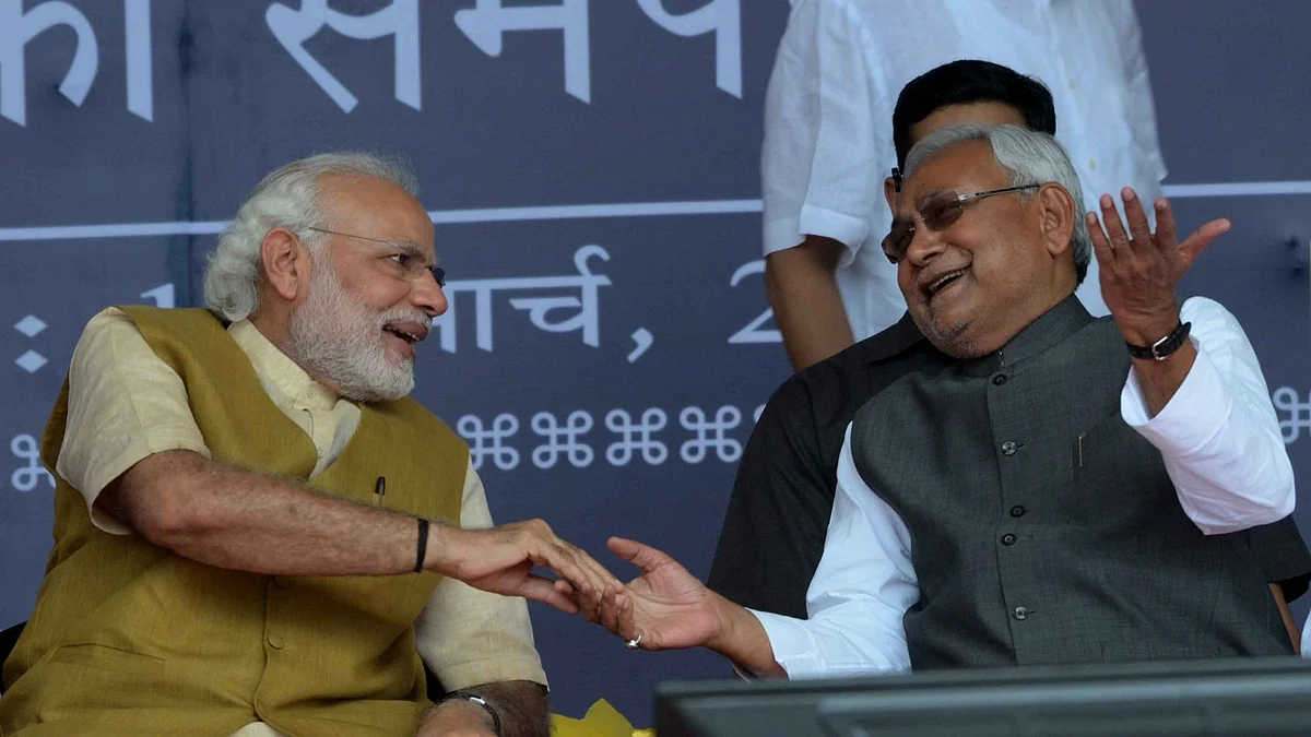 Prime Minister Narendra Modi interacts with Bihar Chief Minister Nitish Kumar during the foundation stone laying ceremony of the various Railway projects, at Hajipur, in Bihar on March 12, 2016. (Photo: IANS)