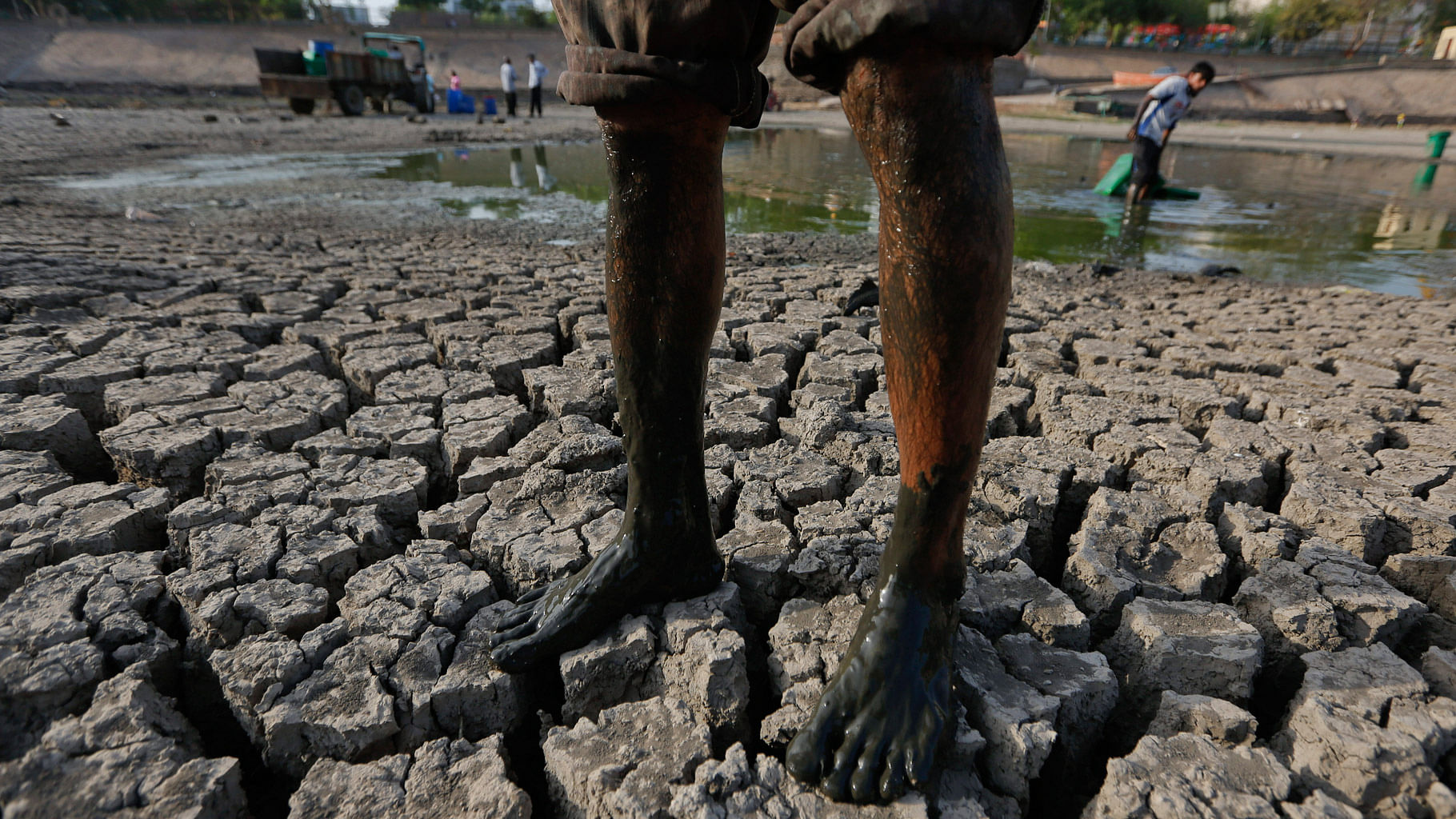  A man stands on the parched bed of the Vastrapur Lake in Ahmedabad, on Sunday, 24 April, 2016. (Photo: AP/Ajit Solanki)