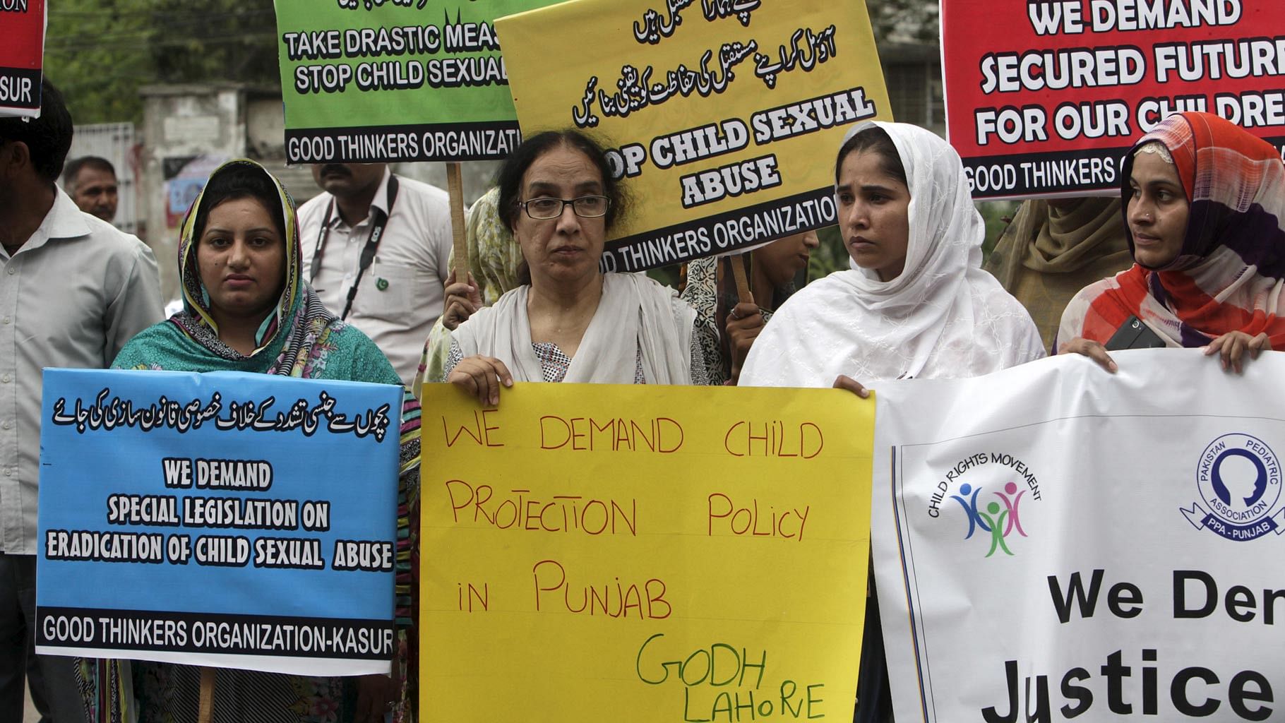 Activists of Pakistani NGO PPA (Pakistan Pediatric Association Punjab) hold placards in a protest against child abuse in Lahore, Pakistan on 13 August, 2015.(Photo: Reuters)