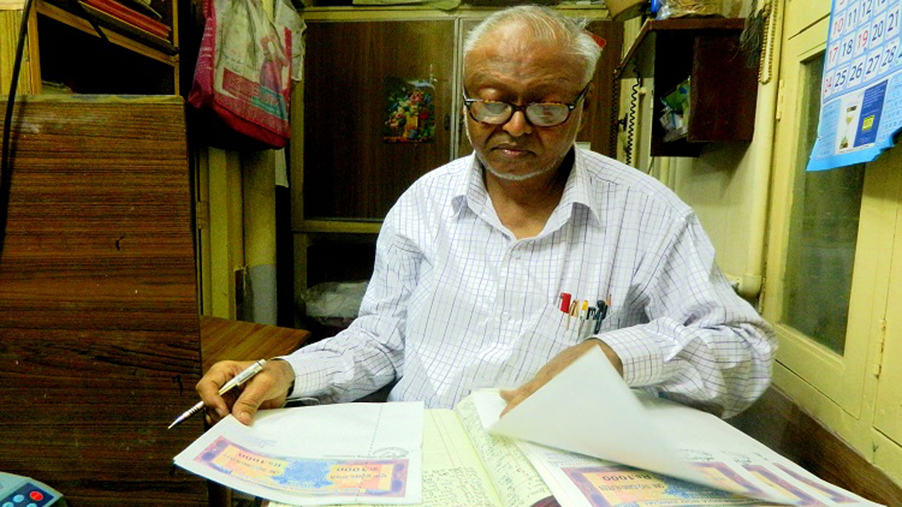 Rouf Basha has been in the stamp paper business for 20 years. (Photo Courtesy: <i>The News Minute</i>)
