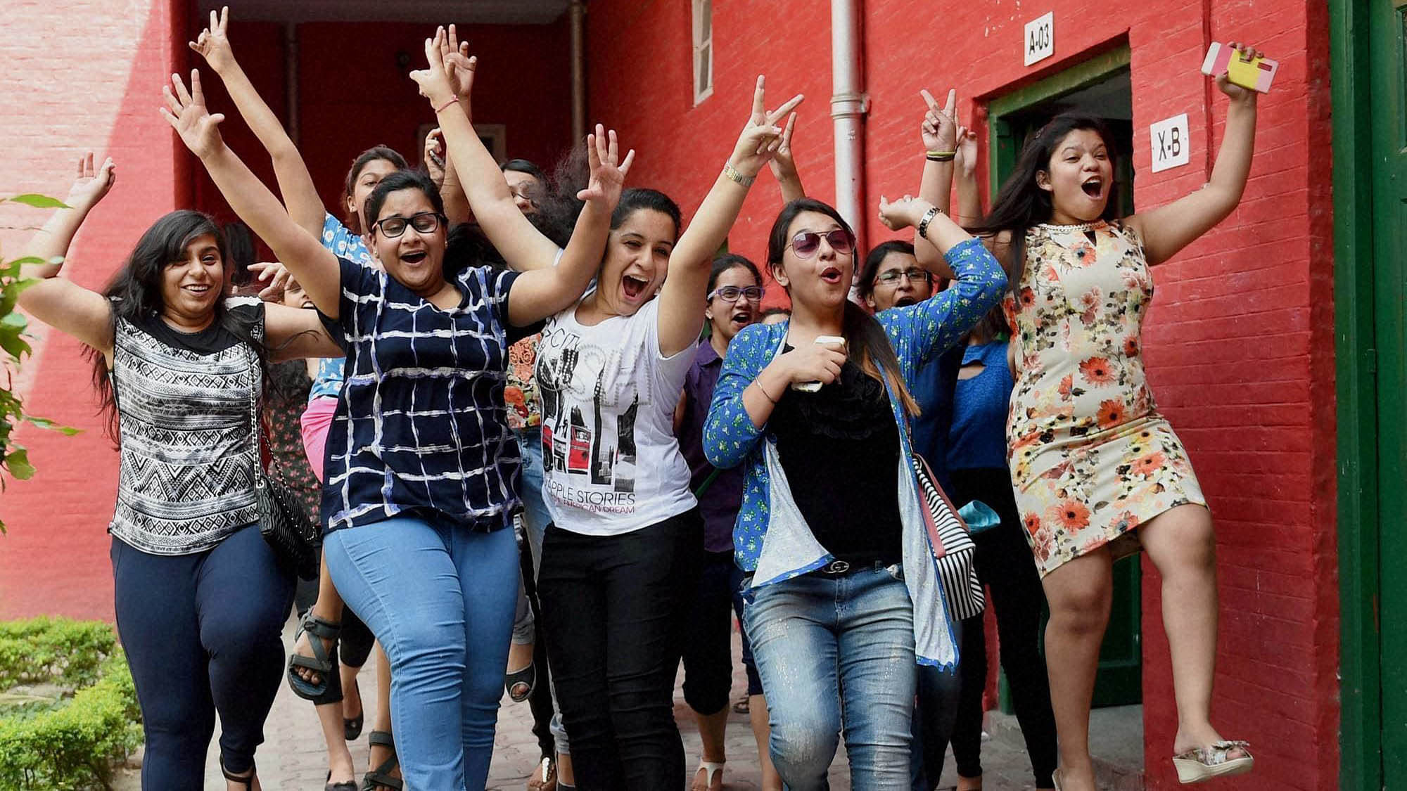 Students celebrate after CBSE results.
