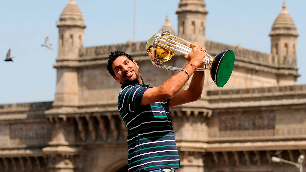 India’s Yuvraj Singh lifts the trophy at the Taj hotel the day after India defeated Sri Lanka in the ICC Cricket World Cup final in Mumbai. 