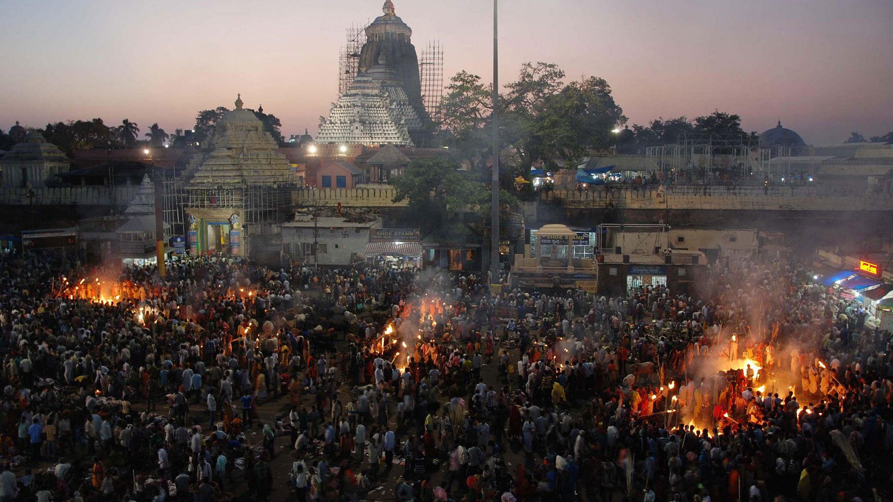 Devotees witness the rituals being performed at the lord Jagannath Temple to pay homage to their ancestors in Puri on the occasion of Diwali. (Photo Courtesy: IANS)