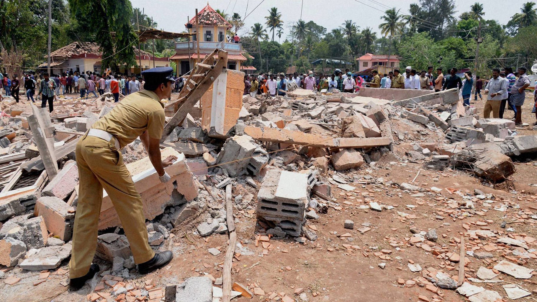 A view of a collapsed building after a massive fire broke out during a fireworks display in Paravoor, north of Thiruvananthapuram, Kerala on Sunday. (Photo: PTI)