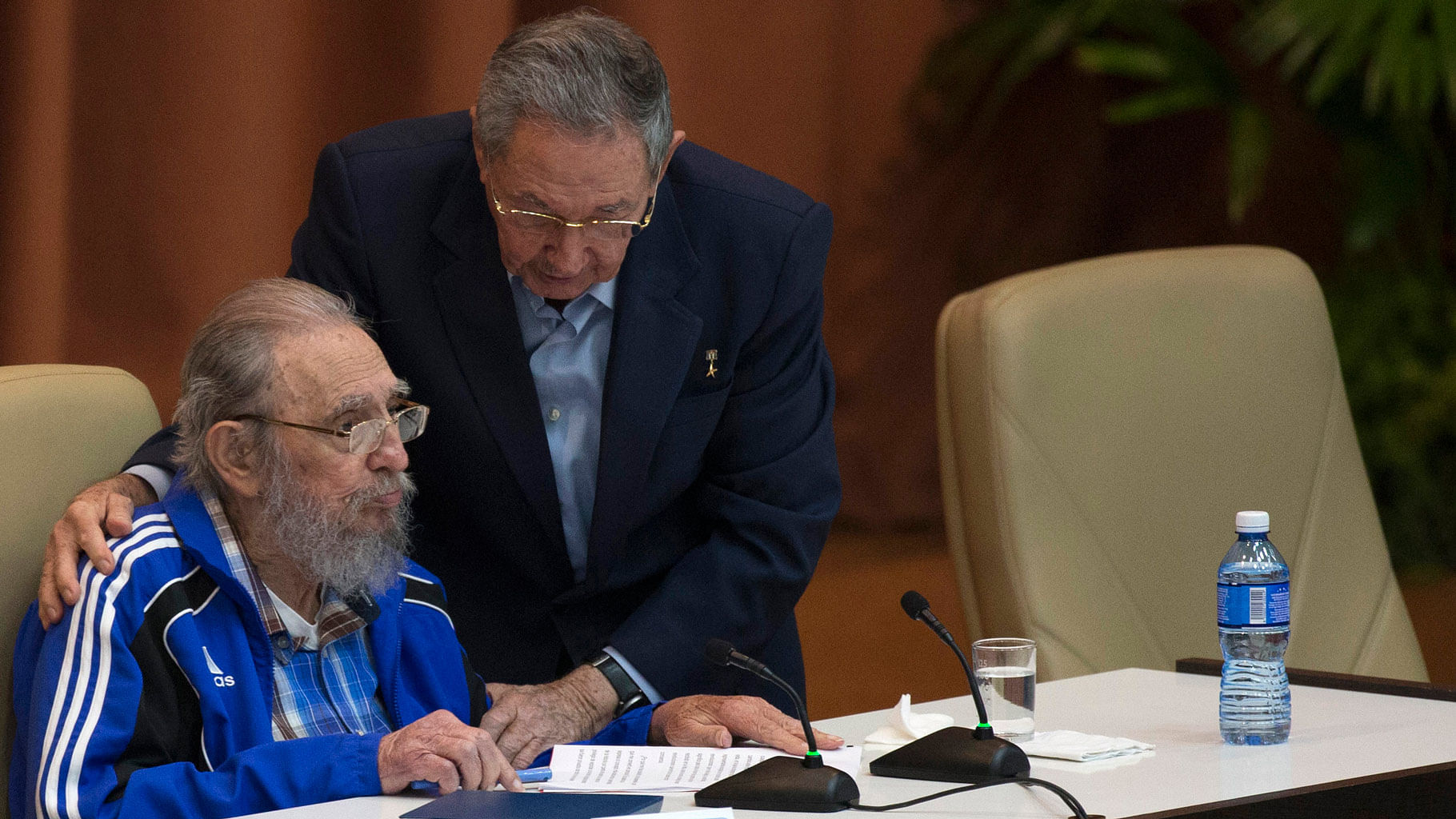 Cuba’s President Raul Castro, right, embraces his brother Fidel as he leans over to speak with him during the last day of the 7th Cuban Communist Party Congress in Havana, Cuba. (Photo: AP)