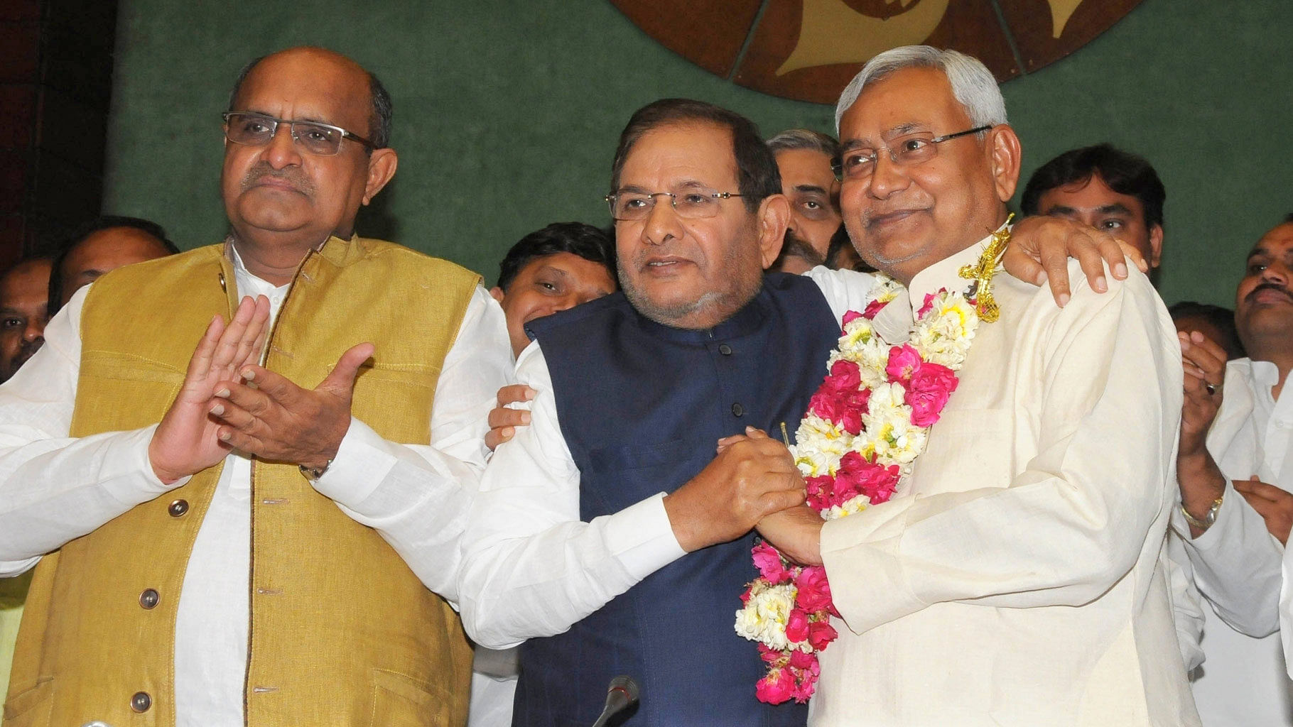 Bihar Chief Minister Nitish Kumar by Sharad Yadav (center) with JD(U) general secretary KC Tyagi in Delhi, on 10 April 2016. (Photo: IANS)