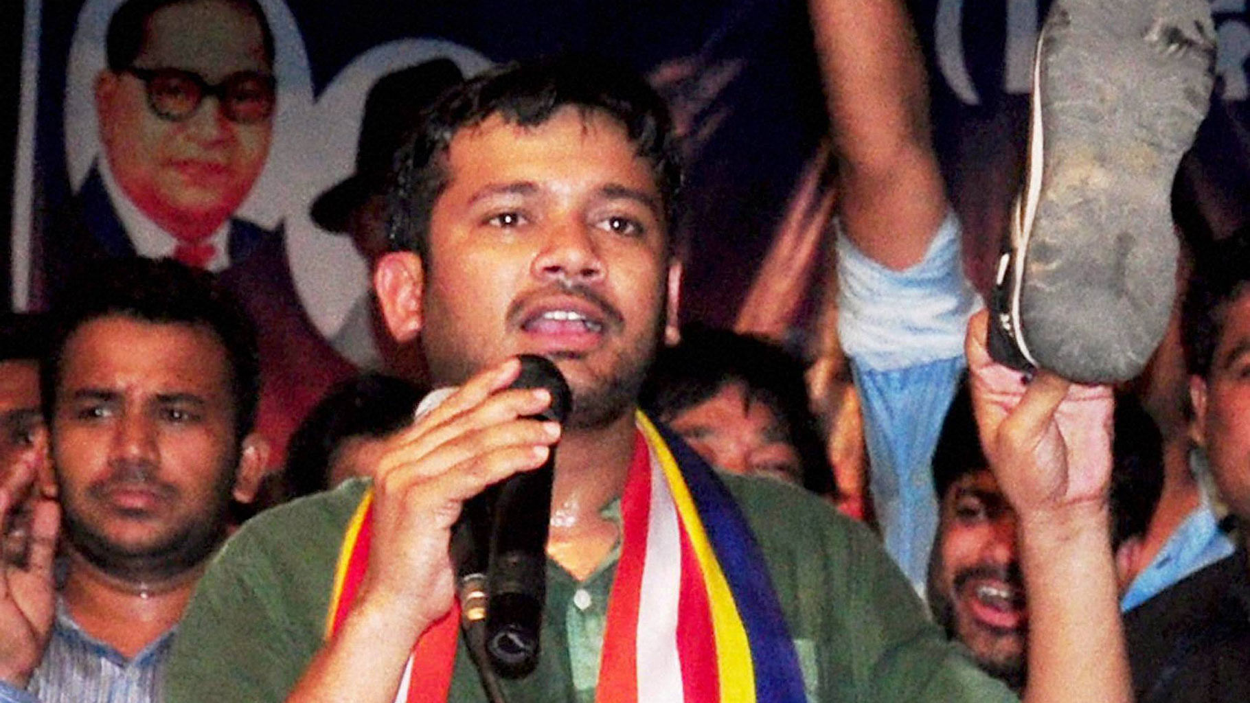 JNUSU President Kanhaiya Kumar showing the shoe that was hurled at him by a Bajrang Dal activist during a lecture session in Nagpur on Thursday. (Photo: PTI)