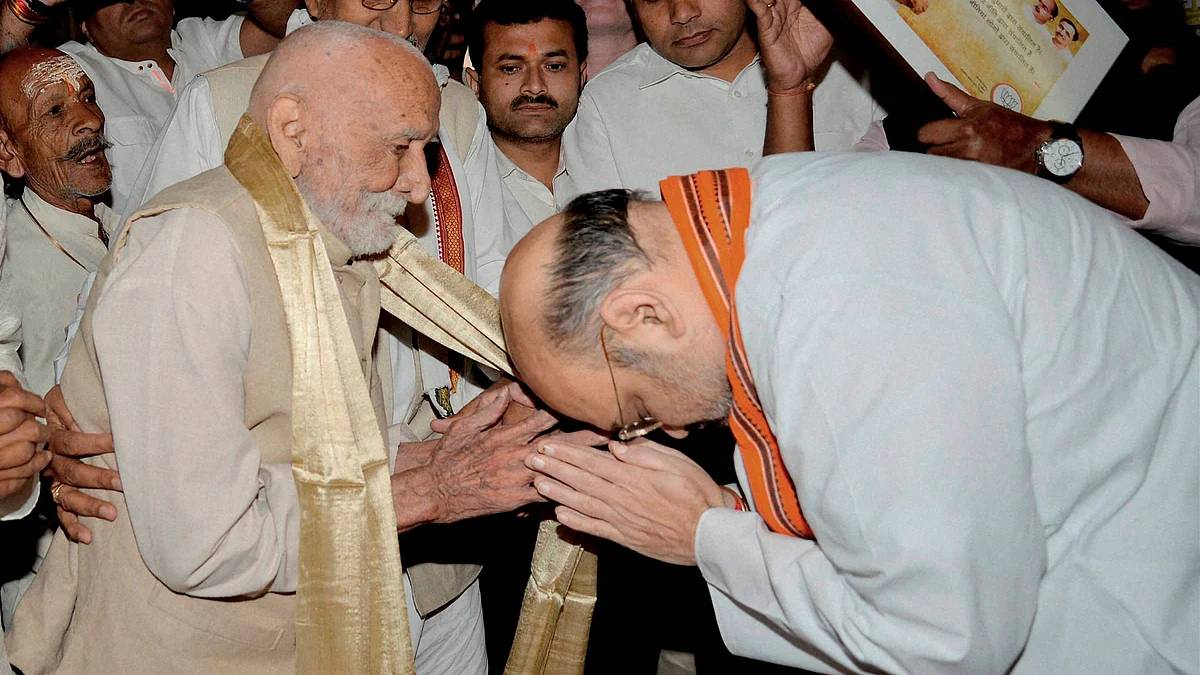 BJP President Amit Shah being blessed by an elderly man during a public programme on the occasion of the BJP’s foundation day at Mavalankar Hall in New Delhi on Wednesday. (Photo: PTI)