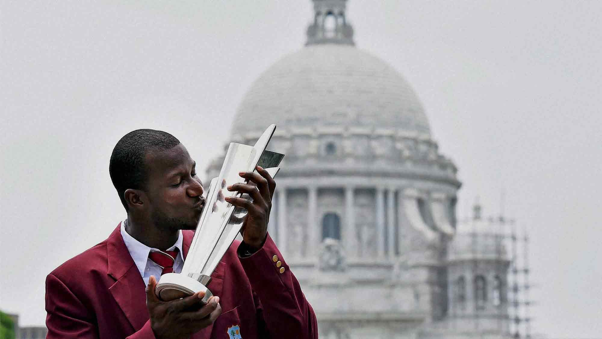 Kolkata: West Indies Captain Darren Sammy kisses the ICC T20 World cup trophy in front of Victoria Memorial in Kolkata on Monday. (Photo: PTI)