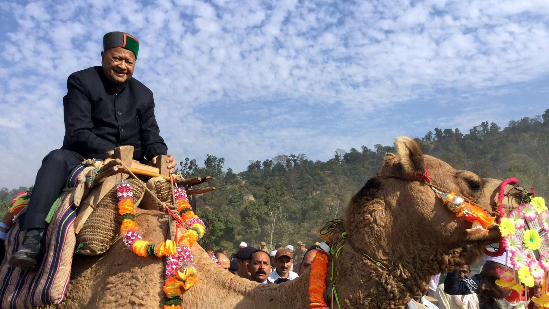

Himachal Chief Minister Virbhadra Singh enjoys a camel ride during International Renuka Fair in Sirmour, Himachal on November 22, 2015. (Photo: IANS)