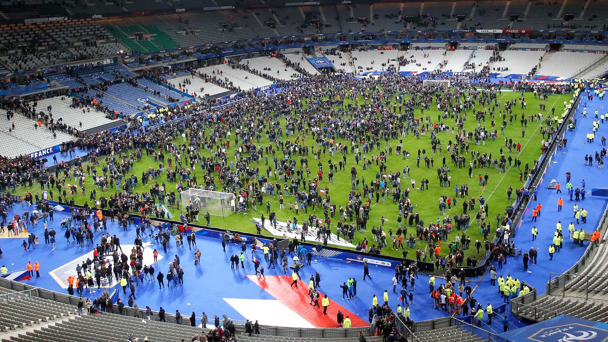 Spectators invaded the pitch of the Stade de France stadium after the friendly between France and Germany on Friday, Nov. 13, 2015. (Photo: AP)