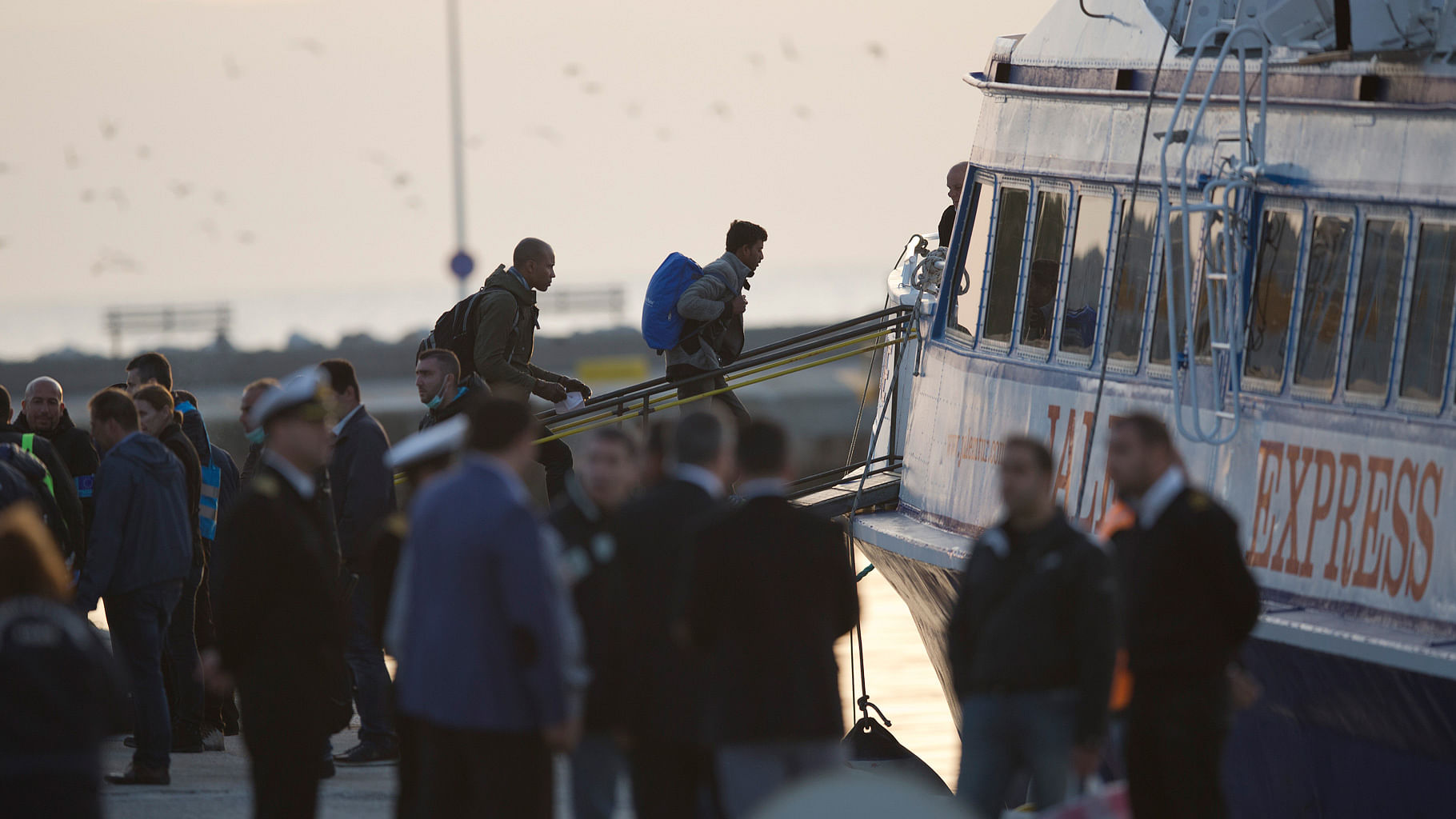 Migrants get on a ferry at the port of Mytilini in the Greek island of Lesbos, Monday, 4 April 2016, during the first day of the implementation of the deal between EU and Turkey. (Photo: AP)