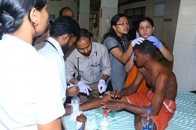 An injured man being treated at a hospital after the Kollam temple fire left around 350 injured. (Photo: IANS)