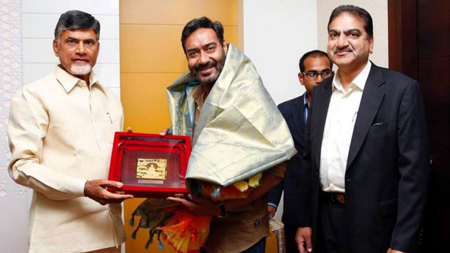 Andhra Pradesh Chief Minister N Chandrababu Naidu with actor Ajay Devgn. (Photo courtesy: <i>TNM</i>)