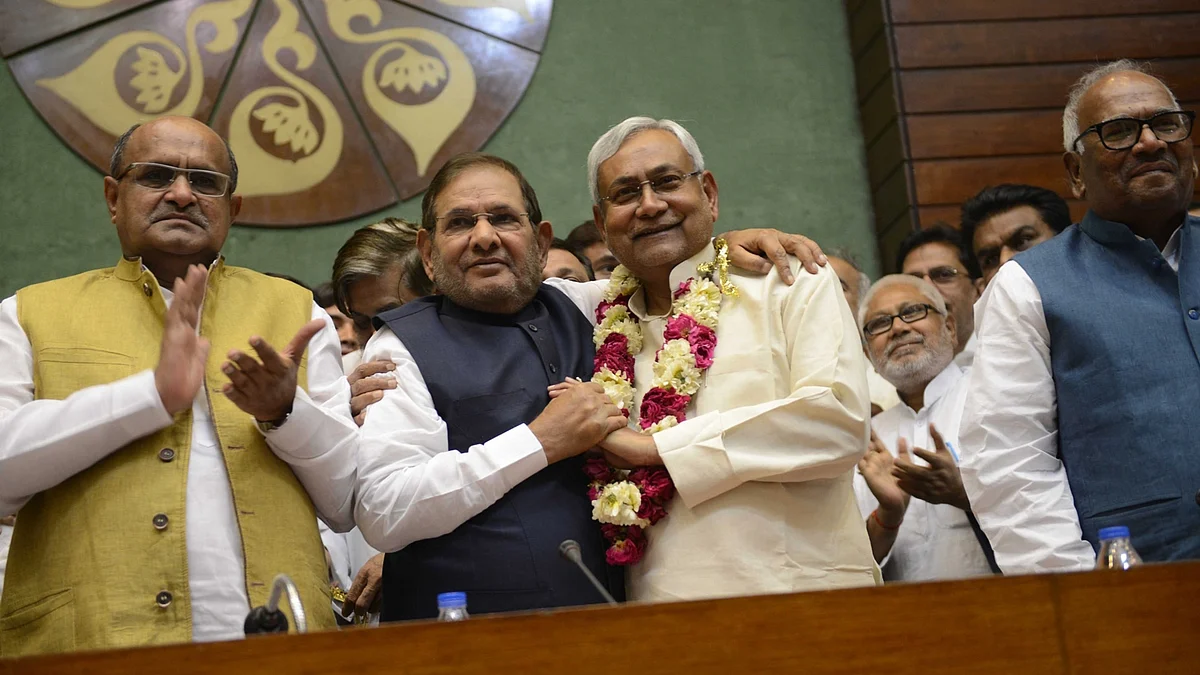 Bihar Chief Minister Nitish Kumar who has been elected the president of JD (U) being greeted by outgoing president Sharad Yadav in New Delhi, on April 10, 2016. (Photo: IANS)