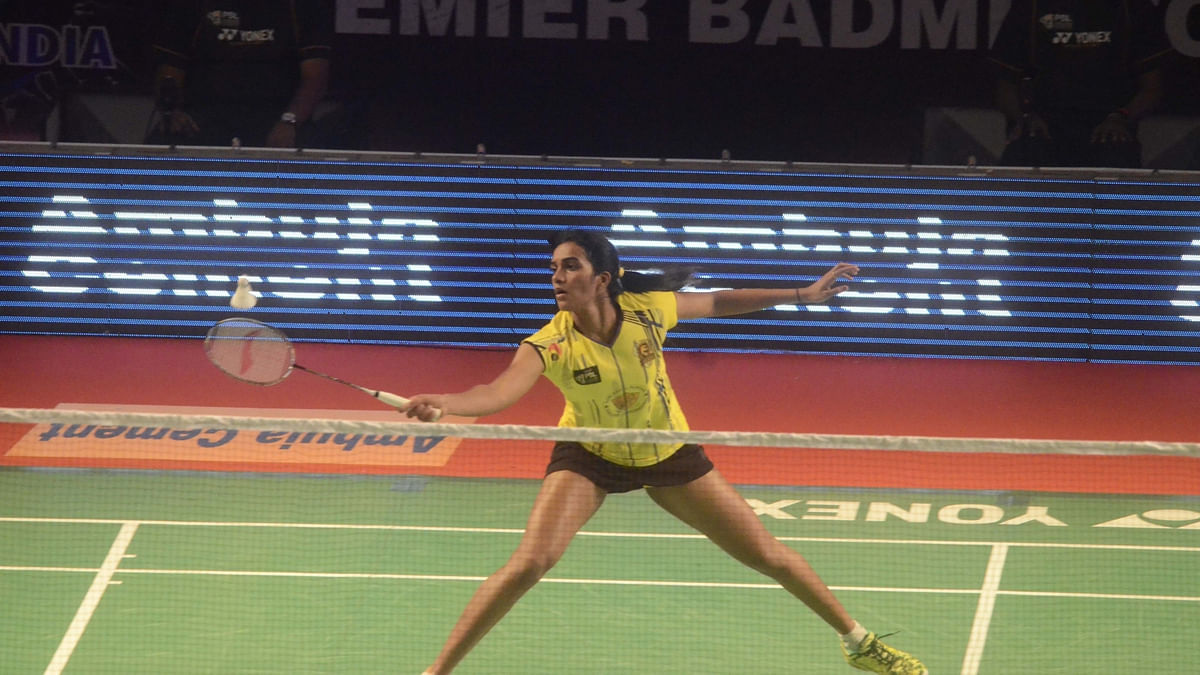 Saina Nehwal advances to the semi-finals of the Malaysia Open while PV Sindhu crashes out of the Quarter Finals.