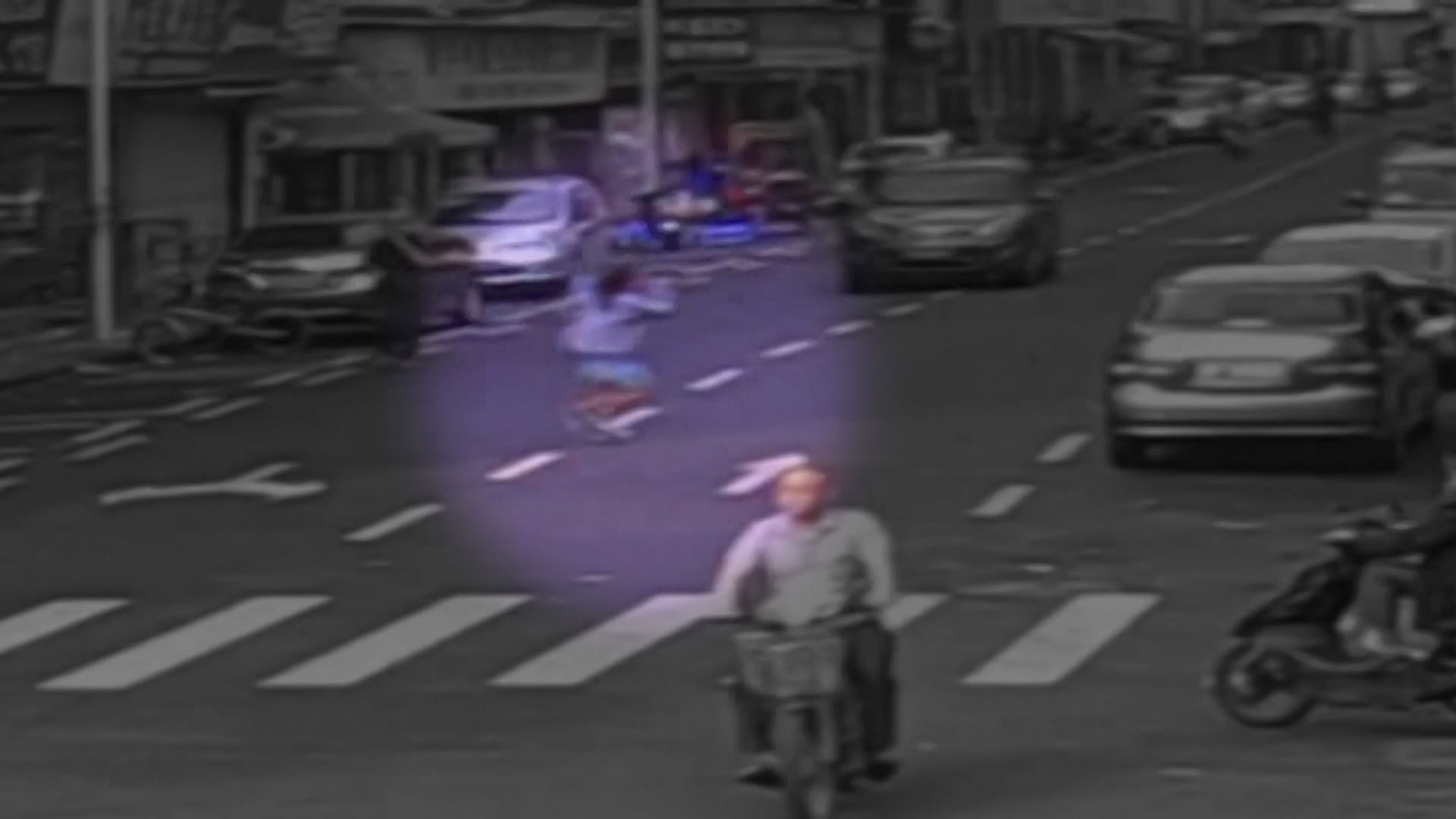 

A Chinese woman hopelessly runs around a street, damaging cars following an argument with her boyfriend. (Photo AP screengrab) 