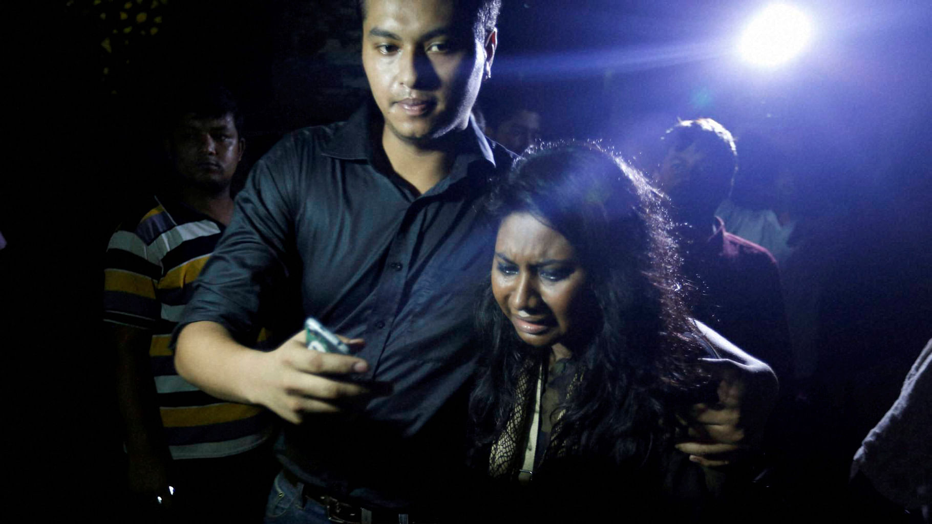 An unidentified co worker of U.S. Agency for International Development, (USAID) employee Xulhaz Mannan who was stabbed to death wails as she returns from the crime spot in Dhaka, Bangladesh. (Photo: PTI)