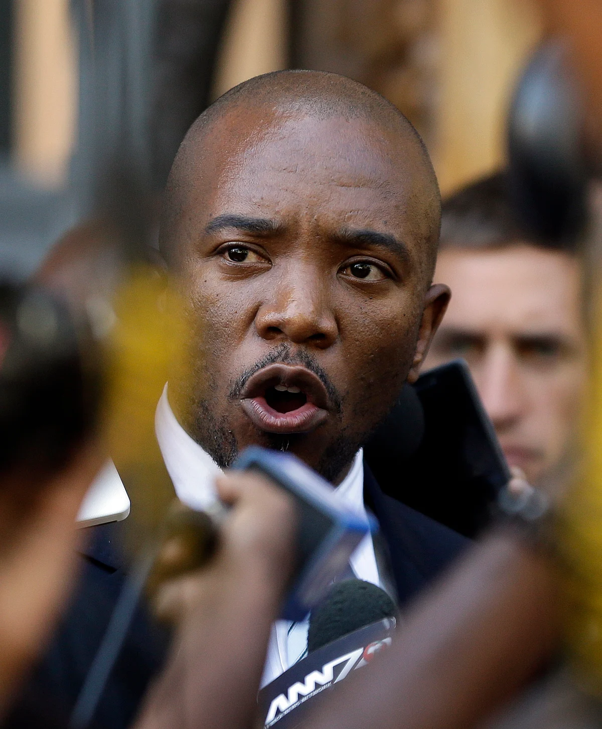 Mmusi Maimane, leader of the Official opposition Democratic Alliance party, addresses journalists outside the Constitutional Court in Johannesburg. (Photo: AP)