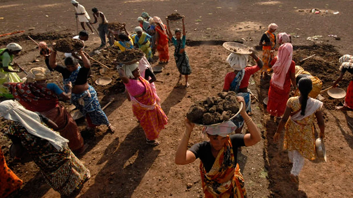 Labourers work on a dried lake it under the Mahatma Gandhi National Rural Employment Guarantee Act on the outskirts of Hyderabad. 