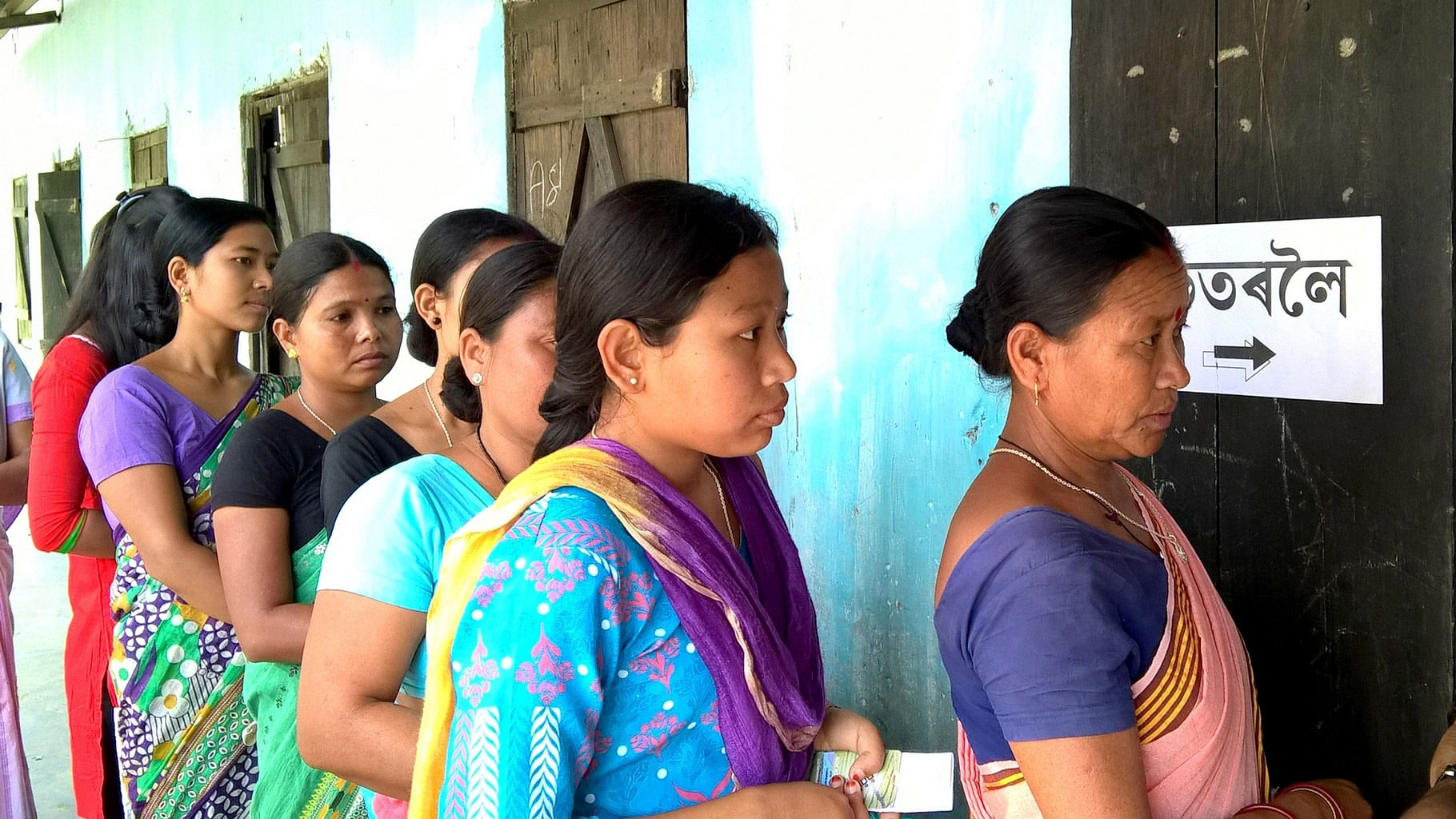 

Women wait  to cast their votes at a polling booth, during the first phase of Assam assembly elections, in Sonitpur district on April 4, 2016. (Photo: IANS)