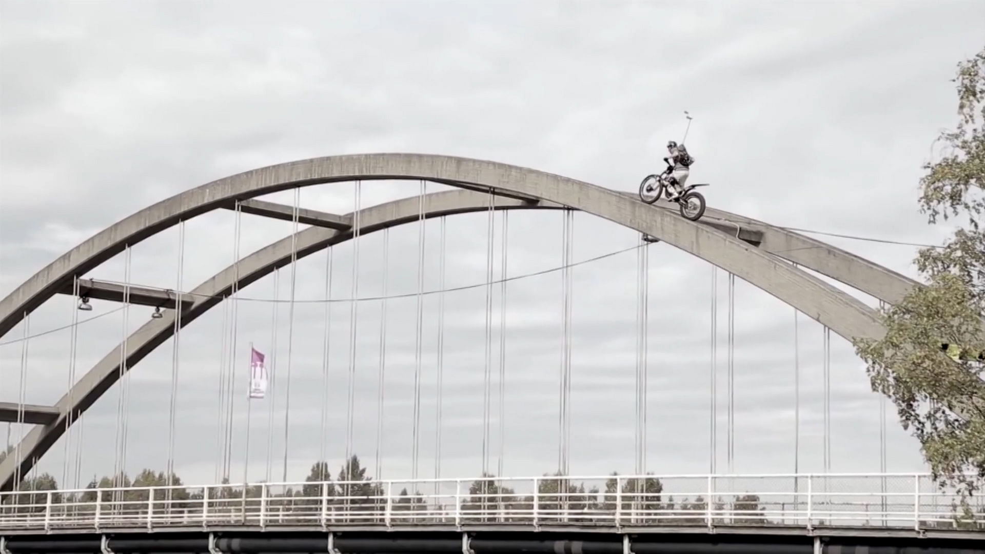 

Antti Pendikainen used his trial bike to ride over the suspension railings on the side of a bridge near Helsinki. (Photo: AP screengrab)