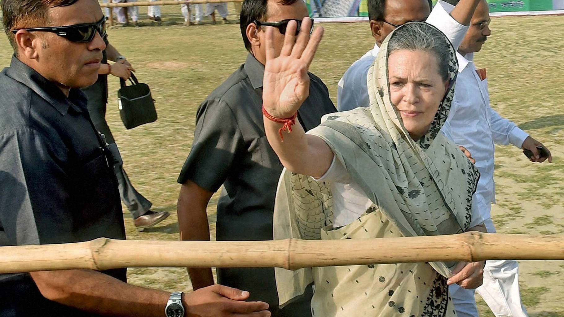 Congress President Sonia Gandhi waves to the crowd during an election campaign rally in South 24 Pargana on Tuesday. (Photo: PTI)