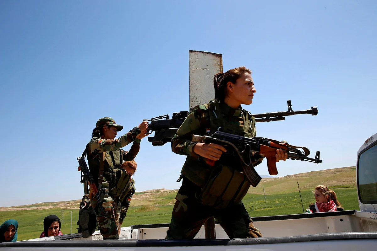 Yazidi female fighters in pickup truck during a deployment near the frontline of the fight against Islamic State militants in Nawaran near Mosul, Iraq. (Photo: Reuters)