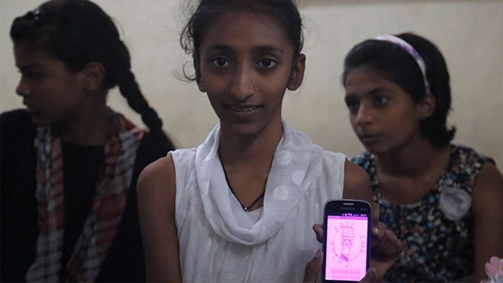 One of the girls shows an app made by the Dharavi children. (Photo Courtesy: Twitter/<a href="https://twitter.com/DharaviDiary">@DharaviDiary</a>)