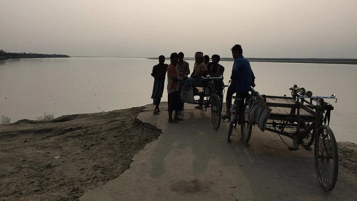 In South Salmara and its adjoining areas, soil erosion caused by the Brahmaputra for years has displaced people and destroyed property. (Photo: Tridip K Mandal/ <b>The Quint</b>)