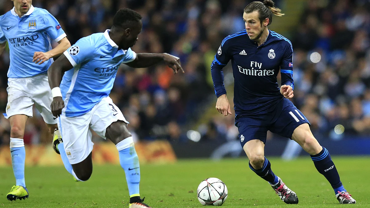 Bale fights for the ball against Manchester City’s Bacary Sagna during the first leg. (Photo: AP)