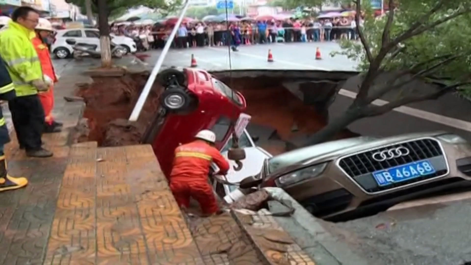 A CCTV footage from China captured a sinkhole emerging in the middle of the road. (Photo: AP/Newsflare screengrab)